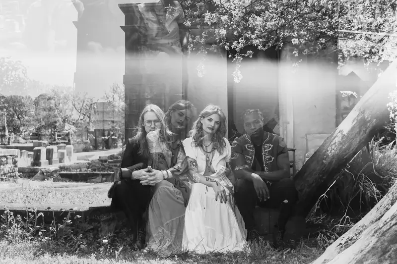Story Ghost photographed in a cemetery, black and white, double exposed.