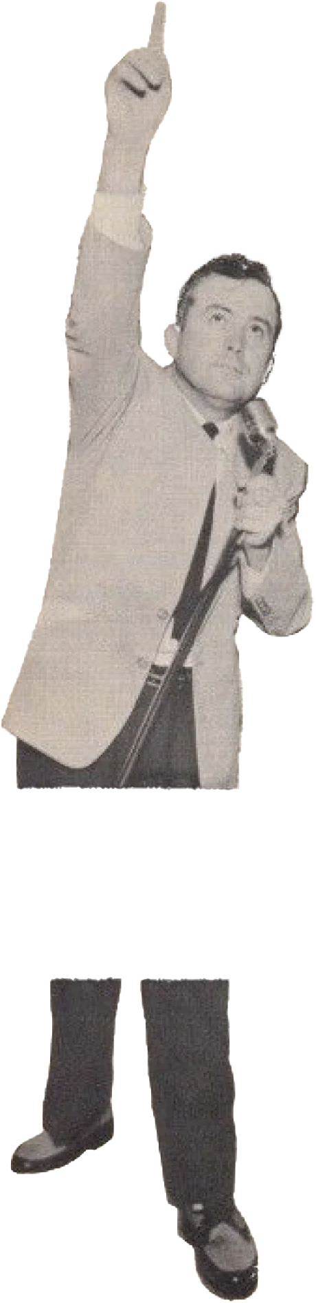 A preacher in a suit, one arm raised, pointing skyward.