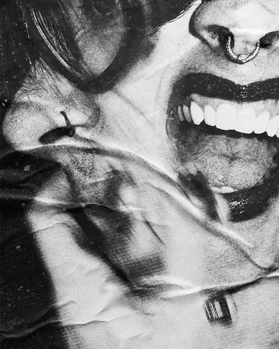 Two faces pressed close, black and white