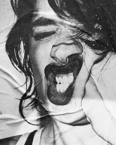Head tipped back mid-shout, black and white